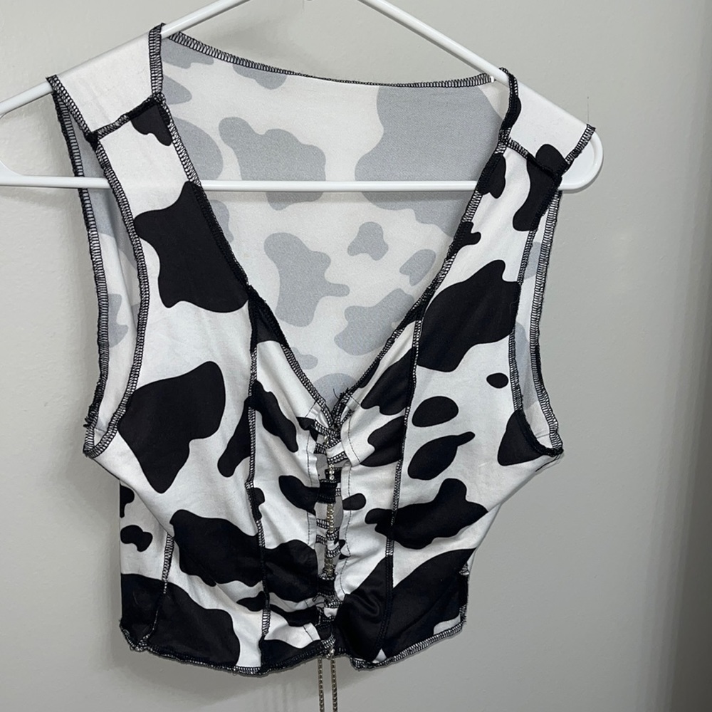Rhinestone cow print lace up top